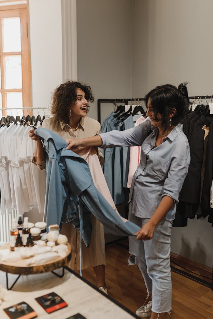 why-choose-us Two women enjoying their shopping experience in a stylish boutique.